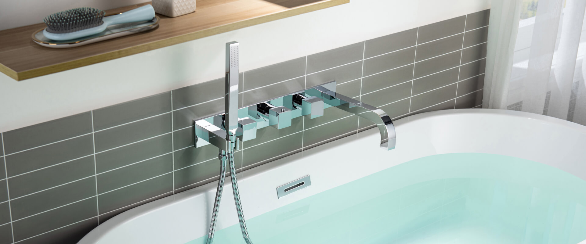 wall mount tub faucet with grey tile