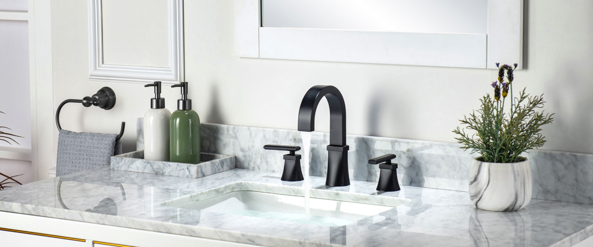 matte black three hole faucet on white marble